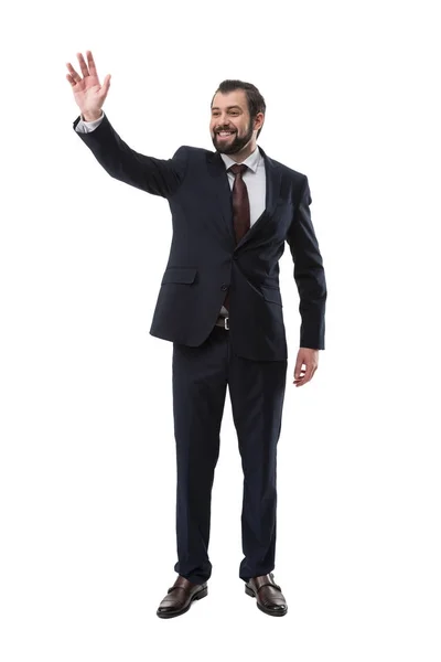 Waving businessman in suit — Stock Photo