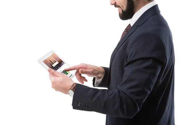 Businessman with tablet with shutterstock website — Stock Photo