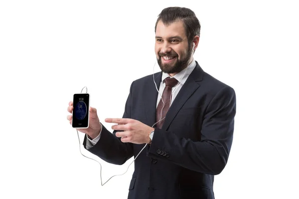 Hombre de negocios apuntando al teléfono inteligente - foto de stock