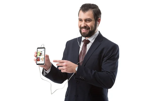 Uomo d'affari che punta a smartphone — Foto stock