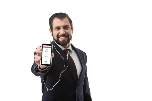 Businessman showing smartphone with website — Stock Photo
