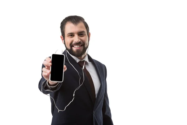 Hombre de negocios con smartphone y auriculares - foto de stock