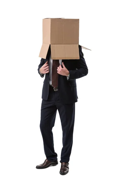 Confident businessman with box on head — Stock Photo