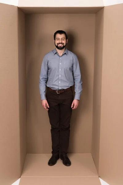 Introvert in cardboard box — Stock Photo