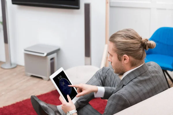 Businessman using ipad tablet at home — Stock Photo