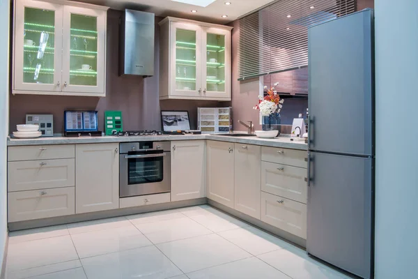Modern kitchen interior with grey refrigerator — Stock Photo