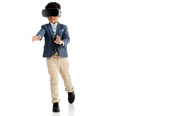 African american boy using vr headset and walking isolated on white — Stock Photo