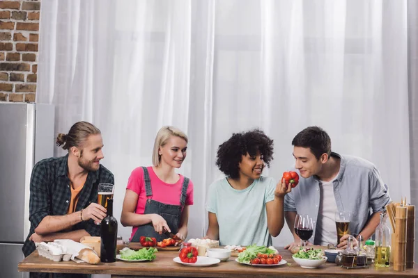 African american girl giving to smell bell pepper to friend — Stock Photo