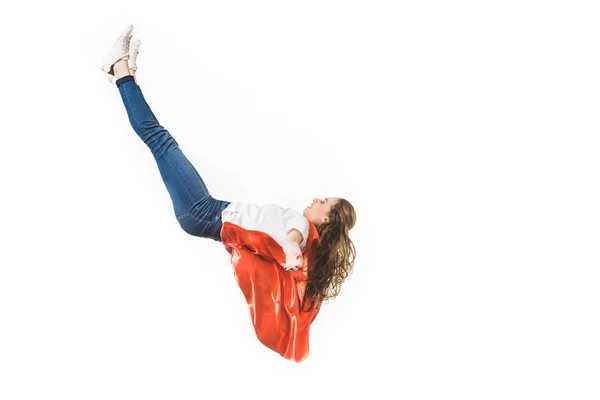 Full length view of girl in red mantle falling isolated on white — Stock Photo