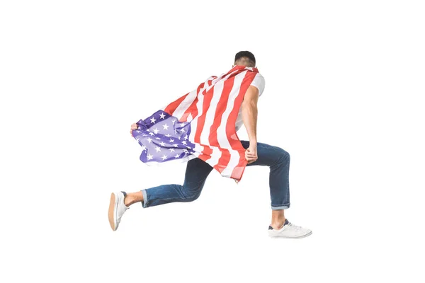 Vista trasera de un joven con bandera americana saltando aislado en blanco - foto de stock