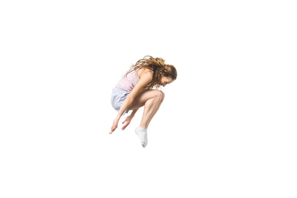 Vista lateral da bela jovem mulher pulando isolado no branco — Fotografia de Stock