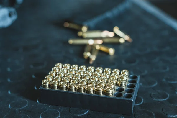 Close up view of bullets in stand on table — Stock Photo