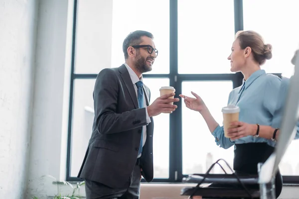 Businesspeople chatting and drinking coffee at office — Stock Photo