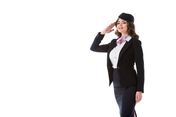 Attractive stewardess saluting isolated on white — Stock Photo