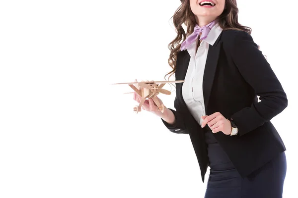 Cropped image of smiling stewardess holding plane model isolated on white — Stock Photo