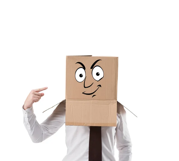 Empresário apontando em caixa de papelão em sua cabeça isolado em branco — Fotografia de Stock