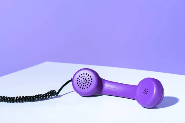 Plastic purple telephone handset, ultra violet trend — Stock Photo