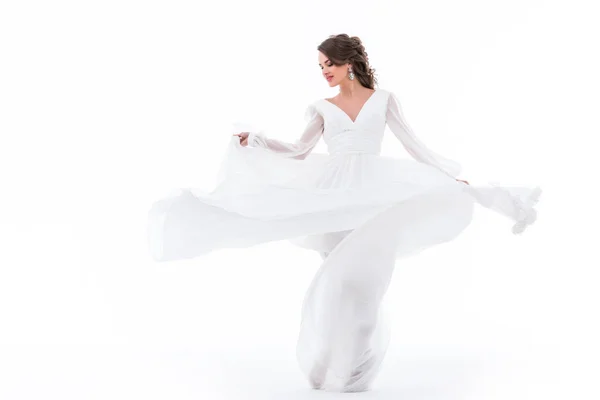 Noiva elegante dançando em vestido branco tradicional, isolado em branco — Fotografia de Stock