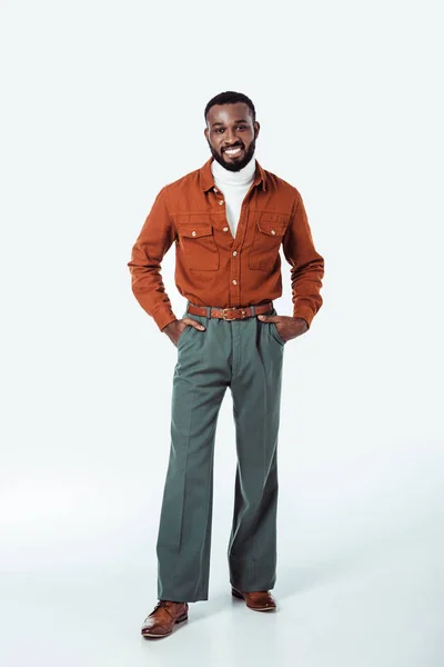 Happy african american retro styled man looking at camera on white — Stock Photo