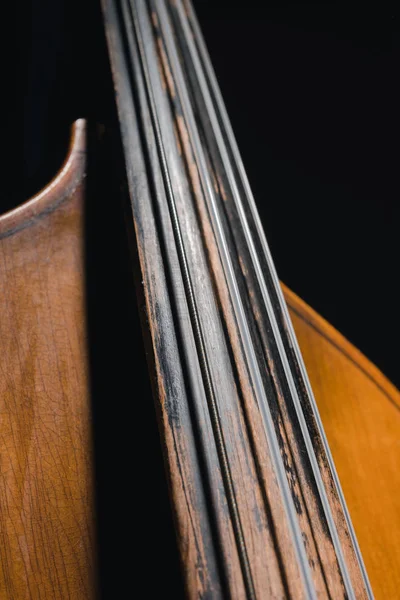 Close-up shot of contrabass viol isolated on black — Stock Photo
