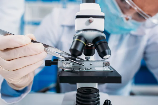 Partial view of scientists working on scientific research together — Stock Photo