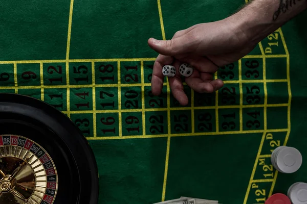 Top view of man gambling on roulette at casino, gambling addiction concept — Stock Photo