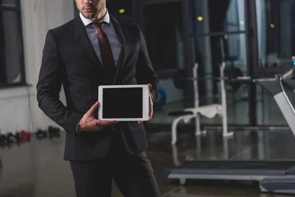 Cropped view of manager presenting digital tablet in sports center — Stock Photo