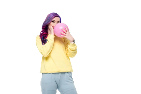 Hermosa joven mujer soplando globo aislado en blanco - foto de stock