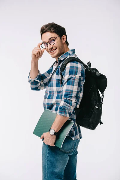 Smiling handsome student looking at camera isolated on white — Stock Photo