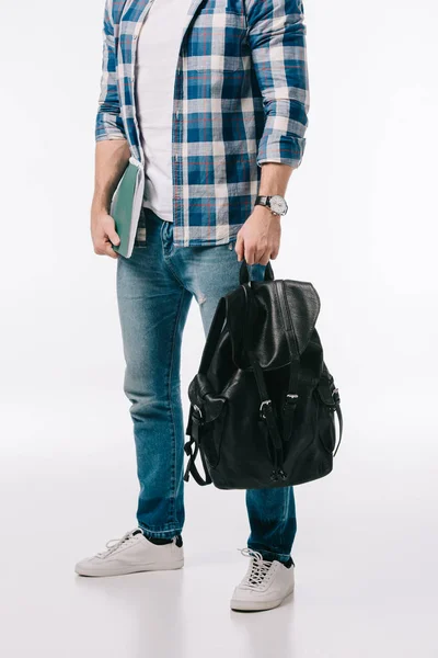 Cropped image of student with backpack and copybook isolated on white — Stock Photo