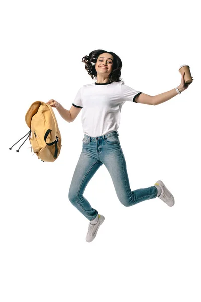 Feliz africano americano adolescente estudiante saltar con taza de café desechable aislado en blanco — Stock Photo