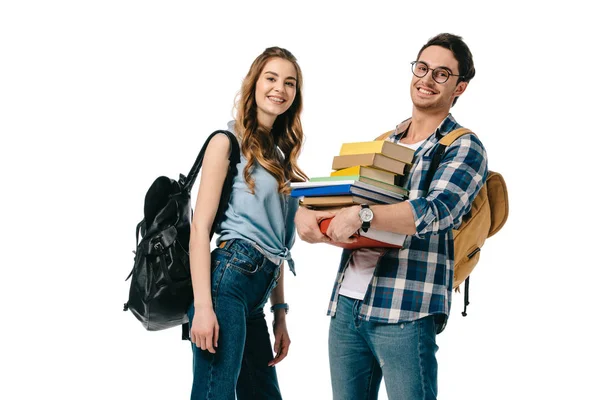 Heureux jeunes étudiants avec des livres isolés sur blanc — Photo de stock