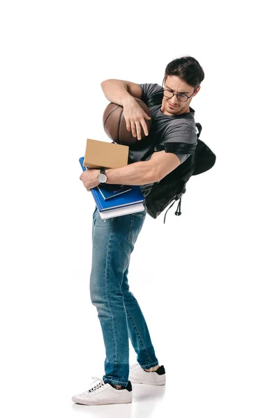 Estudante bonito com livros e bola de basquete em branco — Fotografia de Stock