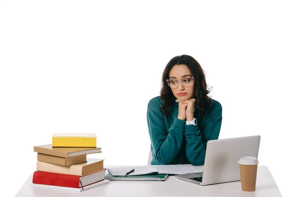 Sad african american teen student looking at stack of books isolated on white — Stock Photo