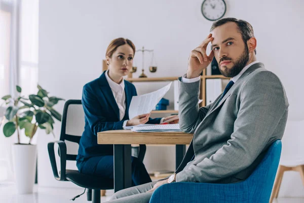 Selective focus of lawyers discussing contract during meeting in office — Stock Photo