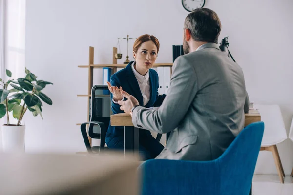 Back view of lawyer having an argument during discussion on meeting in office — Stock Photo