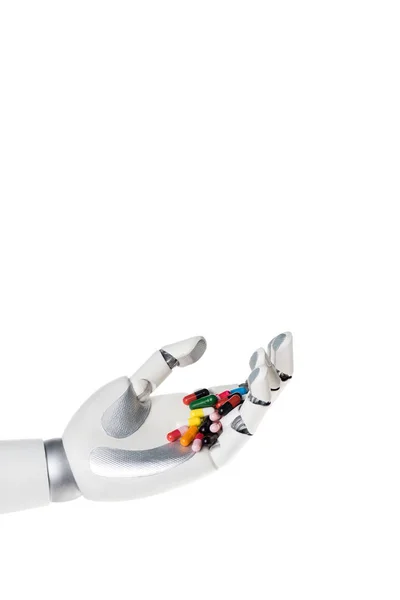 Roboterhand hält Pillen isoliert auf weißem Papier — Stockfoto