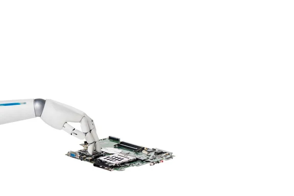 Recortado tiro de robot tocando placa de circuito informático aislado en blanco - foto de stock