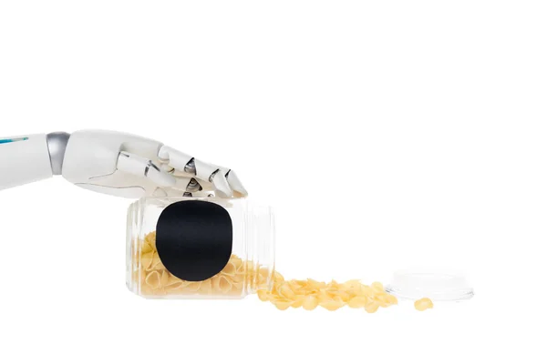 Cropped shot of robot with macaroni spilled from jar isolated on white — Stock Photo
