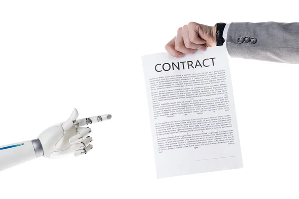 Cropped shot of robot pointing at contract in hand of businessman isolated on white — Stock Photo