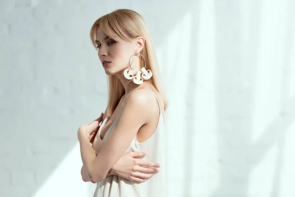 Beautiful pensive woman in dress with earring made of mushrooms, vegan lifestyle concept — Stock Photo