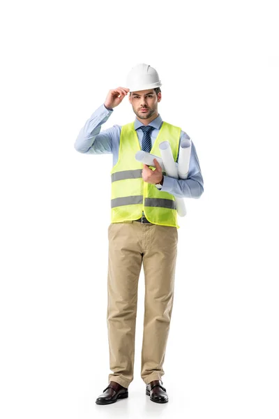 Young man in reflective vest and hard hat holding blueprints isolated on white — Stock Photo