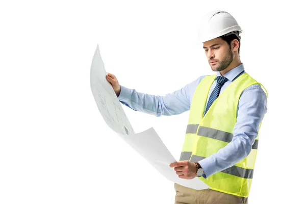 Thoughtful builder in reflective vest looking at blueprint isolated on white — Stock Photo