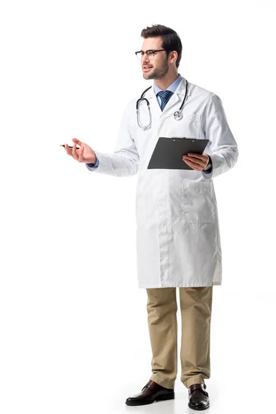 Doctor wearing white coat with stethoscope explaining something and using digital tablet isolated on white — Stock Photo