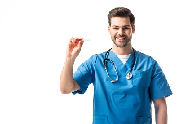 Male nurse wearing blue uniform with stethoscope and holding syringe isolated on white — Stock Photo