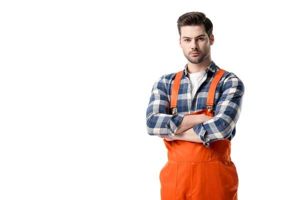 Workman in orange overall standing with folded arms isolated on white — Stock Photo