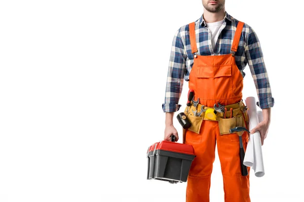 Ausgeschnittene Ansicht des Mannes in orangefarbenem Overall mit Werkzeugkiste und Blaupause isoliert auf weiß — Stockfoto