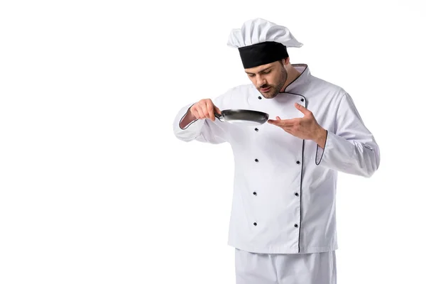 Portrait of young chef with frying pan isolated on white — Stock Photo