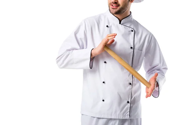 Cropped shot of chef in uniform with wooden rolling pin isolated on white — Stock Photo