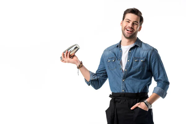 Cheerful barman in apron with shaker in hand isolated on white — Stock Photo